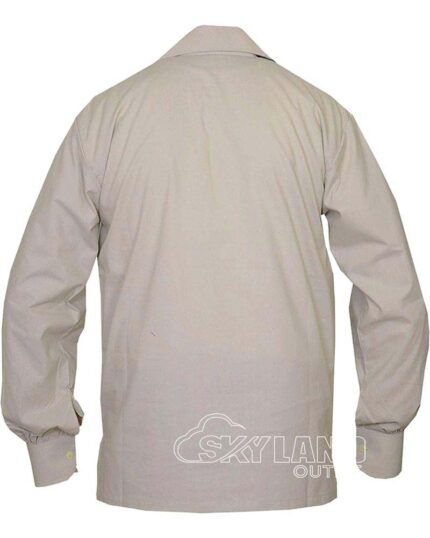 Man in beige full sleeve Jacobite shirt with tartan kilt outfit